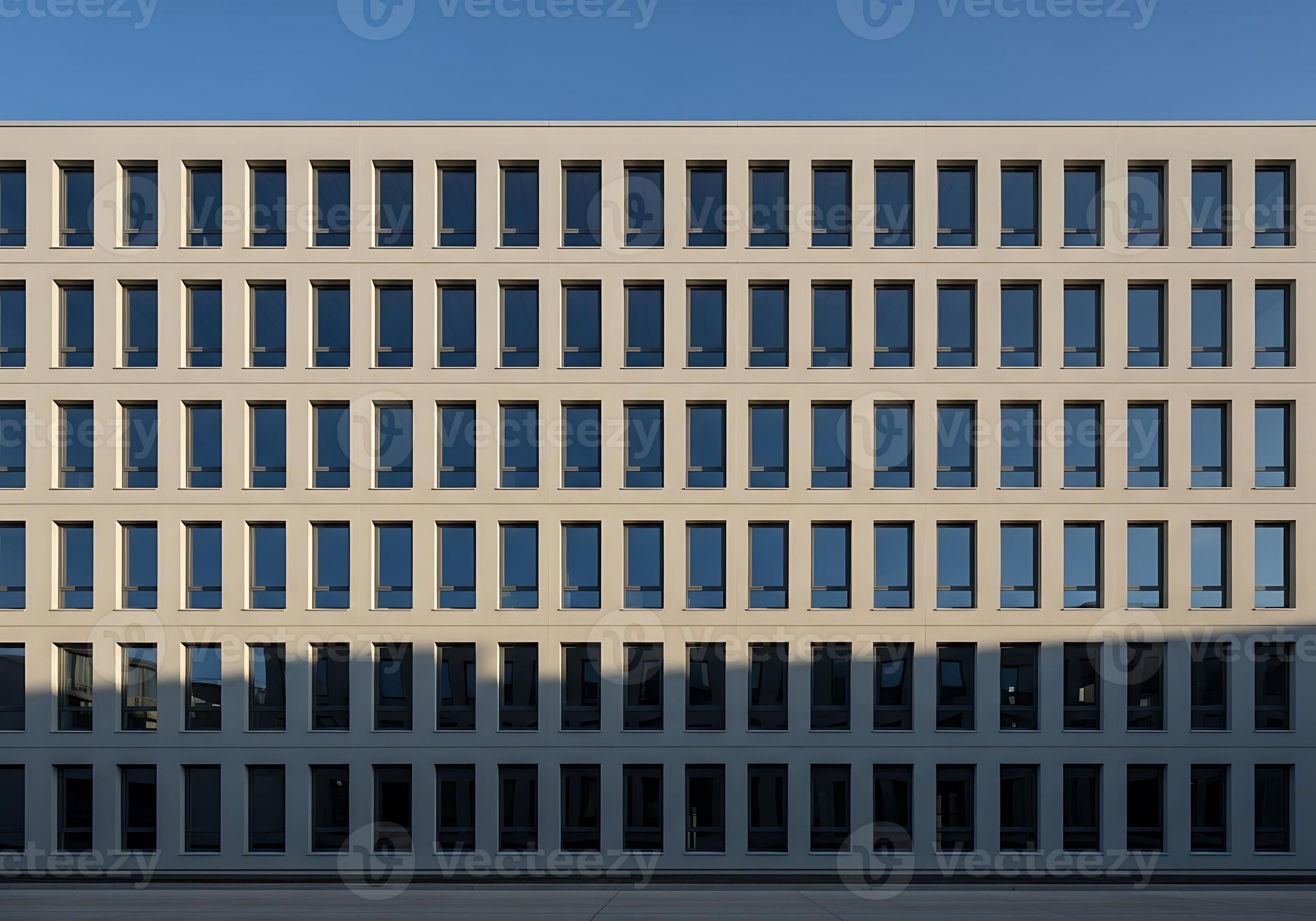Minimalist corporate building facade with parallel columns against blue sky
